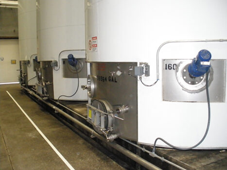 Wine agitators for use in wine storage tanks